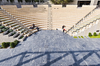 Modern outdoor amphitheater with stone steps and seating