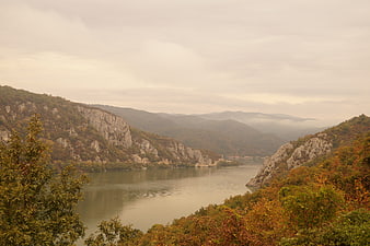 Scenic Danube River Gorge in Romania with Autumn Foliage