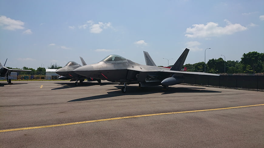 F-35 Lightning II fighter jets parked on airfield tarmac
