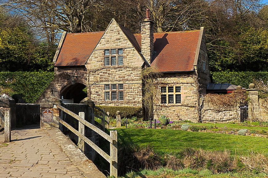 Historic Stone Cottage with Arched Bridge in English Countryside