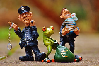 Conceptual Figurines Depicting Tax Evasion, Fraud, and Law Enforcement