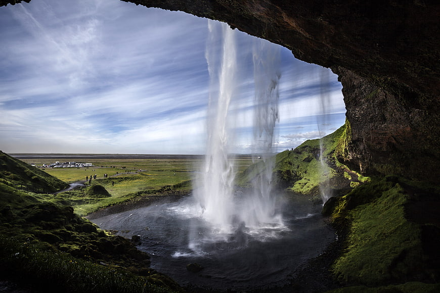 View from behind Seljalandsfoss waterfall in Iceland
