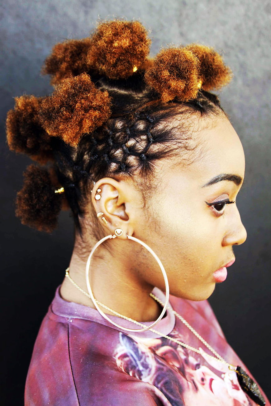 Profile of Woman with Braided Buns and Hoop Earrings