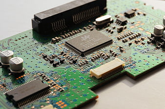 Close-up of green circuit board with electronic components