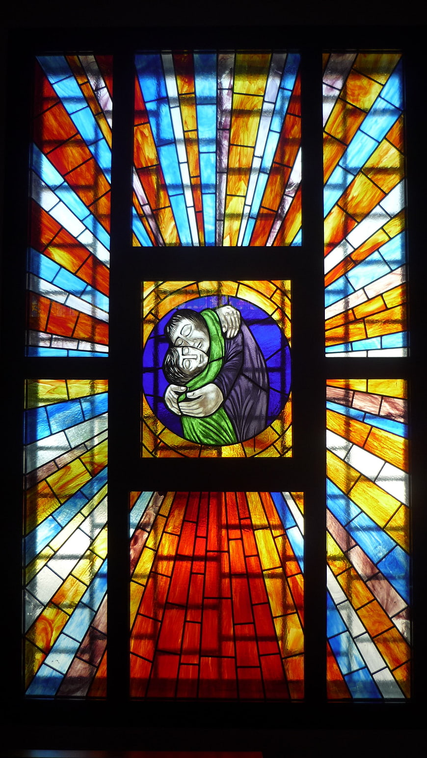 Colorful Stained Glass Window with Hugging Figures