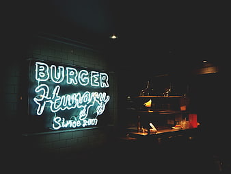Neon Burger Restaurant Sign in Dark Interior
