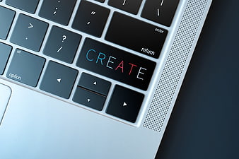 Close-up of laptop keyboard with CREATE text on key