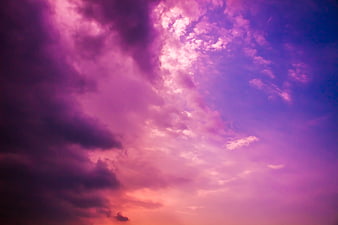 Vibrant purple and pink dramatic sunset clouds sky