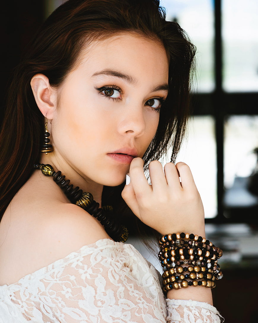 Portrait of Woman with Bohemian Jewelry and Lace Top