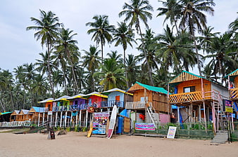 Colorful Beachside Huts And Surfboards In Goa, India