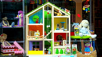 Colorful Wooden Dollhouse Display In Toy Store Window