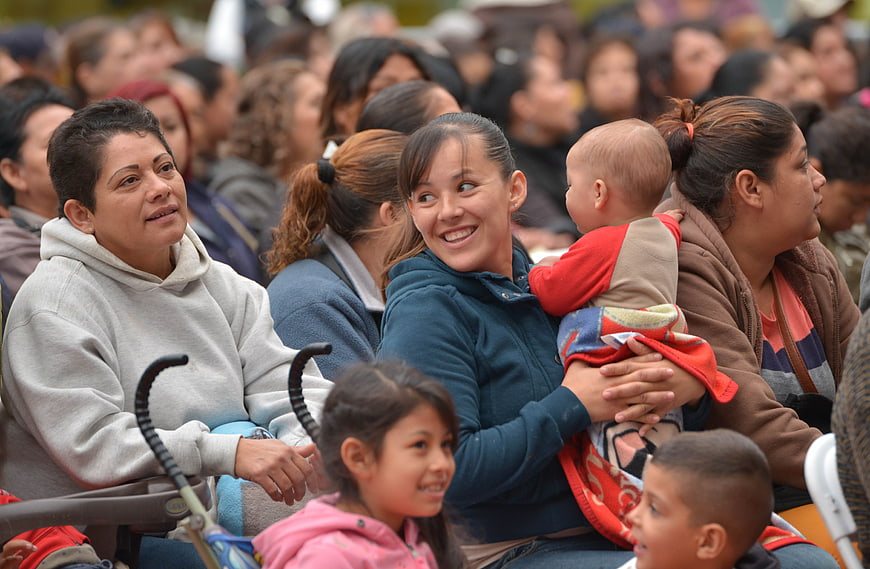 Diverse Audience Of Women And Children Attending Public Event