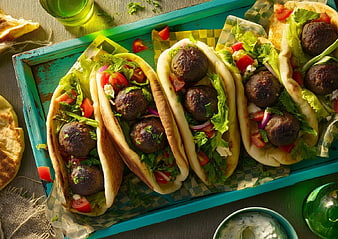 Overhead View of Fresh Falafel Pita Sandwiches on Blue Tray