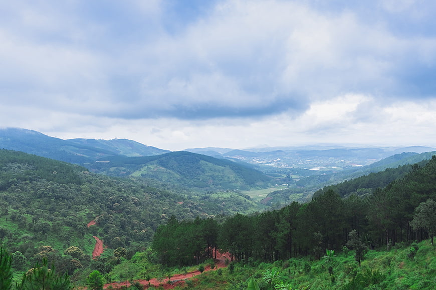 Lush Green Mountain Valley Landscape With Dramatic Clouds