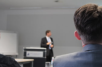 Audience View of Business Presentation in Conference Room