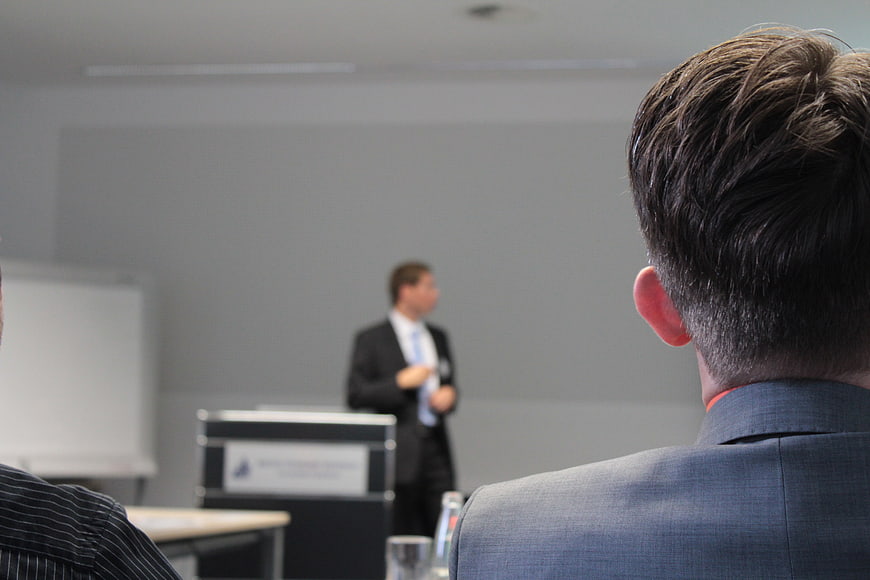 Audience View of Business Presentation in Conference Room