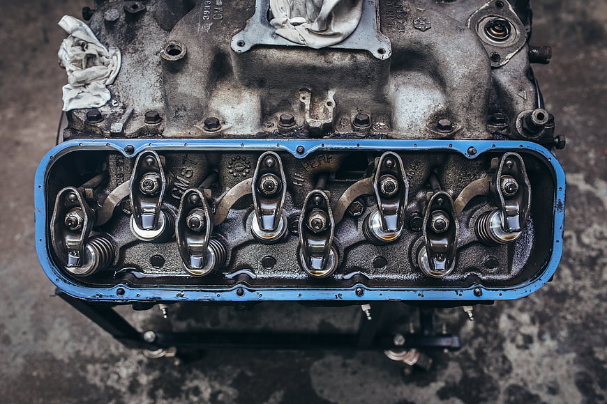 Close-up of vintage car engine valve train with rocker arms