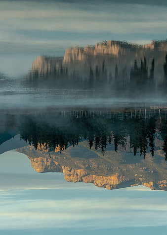 Abstract Surreal Landscape with Inverted Mountain Reflection