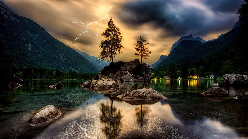 Dramatic Lightning Storm Over Mountain Lake With Tree Reflections