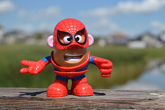 Mr. Potato Head Spider-Man Action Figure On Wooden Surface