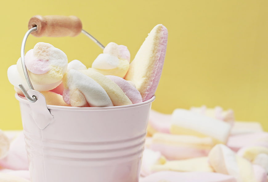Pastel Marshmallows in White Bucket on Yellow Background