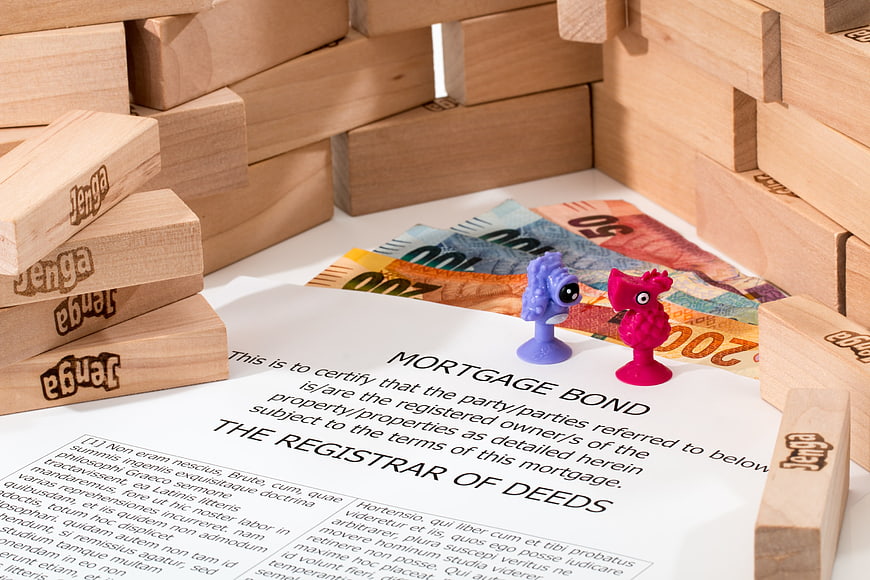 Mortgage Bond Document with Jenga Blocks and Euro Banknotes