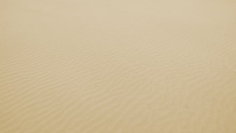 Close-up of rippled sand texture on a beach