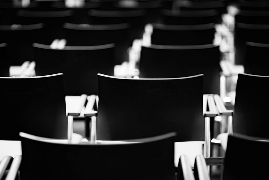 Black and white empty chairs in a conference hall