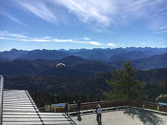 Paraglider Soaring Over Mountain Ranges From Scenic Observation Deck