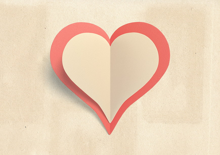 Minimalist Red Paper Heart Cutout on Textured Beige Background