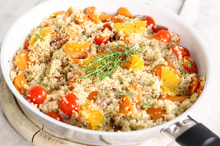 Healthy Quinoa Salad with Oranges and Tomatoes in White Bowl