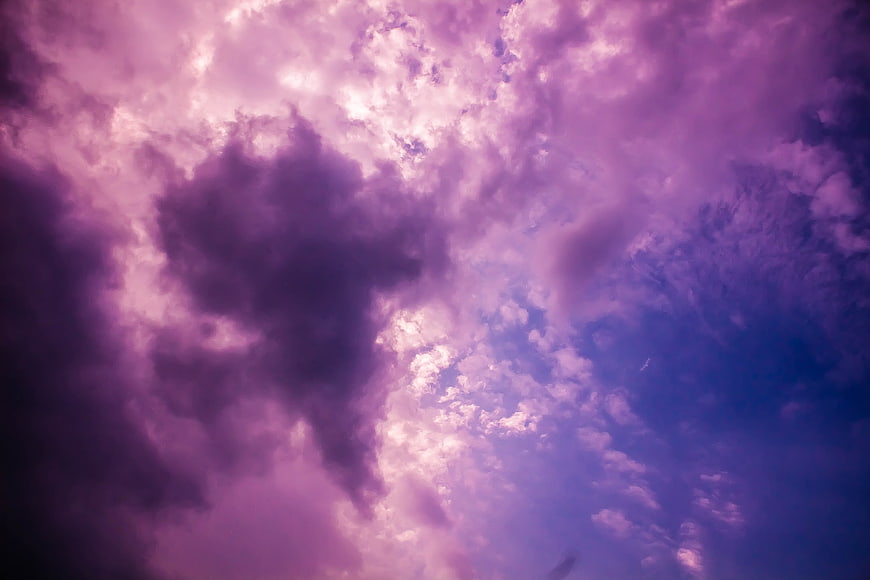 Dramatic purple and pink storm clouds in the sky