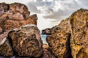 Dramatic sandstone rock formations on a rugged coastal cliff