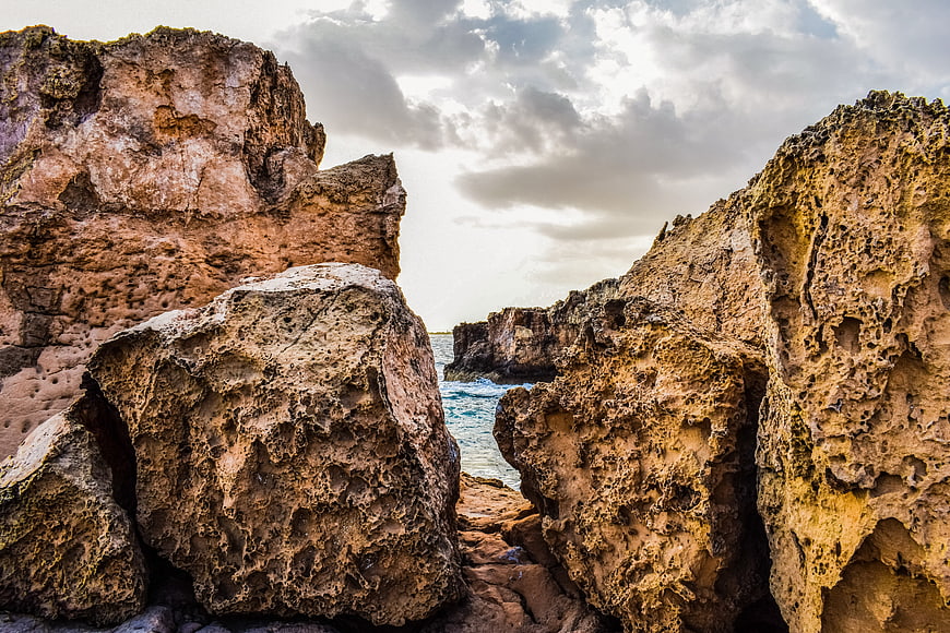 Dramatic sandstone rock formations on a rugged coastal cliff