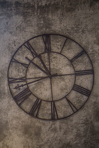 Vintage Metal Wall Clock on Textured Concrete Background