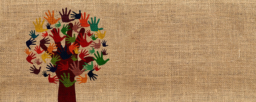 Multicultural handprint tree on burlap background