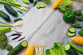 Fresh Raw Vegetables Arranged On Rustic White Wooden Table
