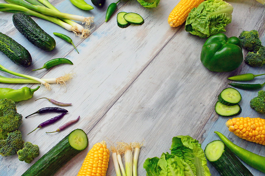 Fresh Raw Vegetables Arranged On Rustic White Wooden Table