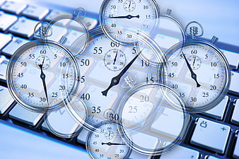 Multiple stopwatches superimposed on a computer keyboard