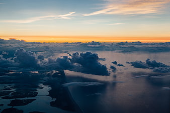 Aerial View of Coastal Landscape at Sunset with Clouds