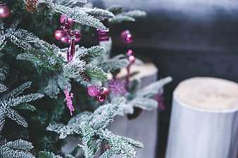 Frosted Christmas Tree with Pink Ornaments and Wood Stumps