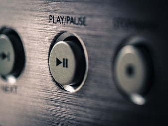 Close-up of Play/Pause Button on Audio Equipment