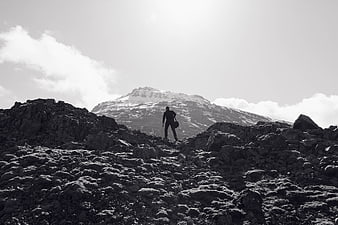 Silhouette of Hiker on Rocky Mountain Ridge in Black and White