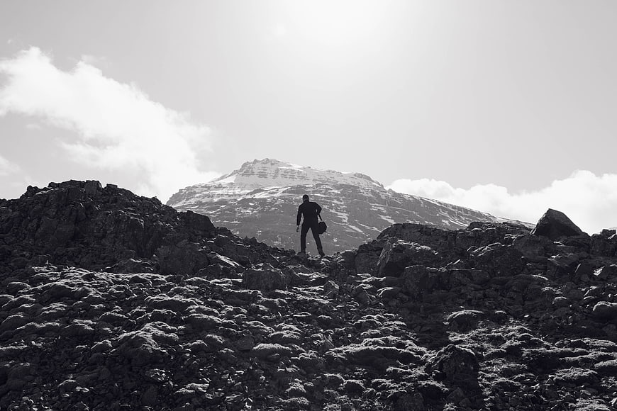 Silhouette of Hiker on Rocky Mountain Ridge in Black and White