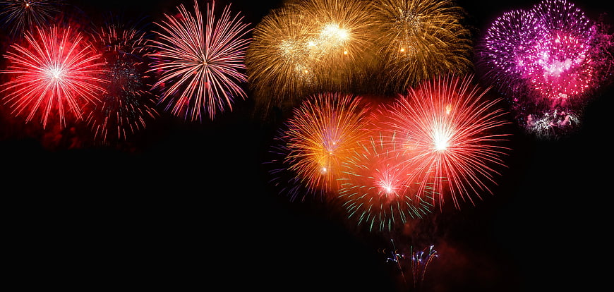 Colorful Fireworks Display on Black Night Sky Background