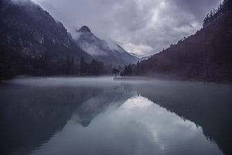 Misty Mountain Lake Reflection in Dark Forest Landscape