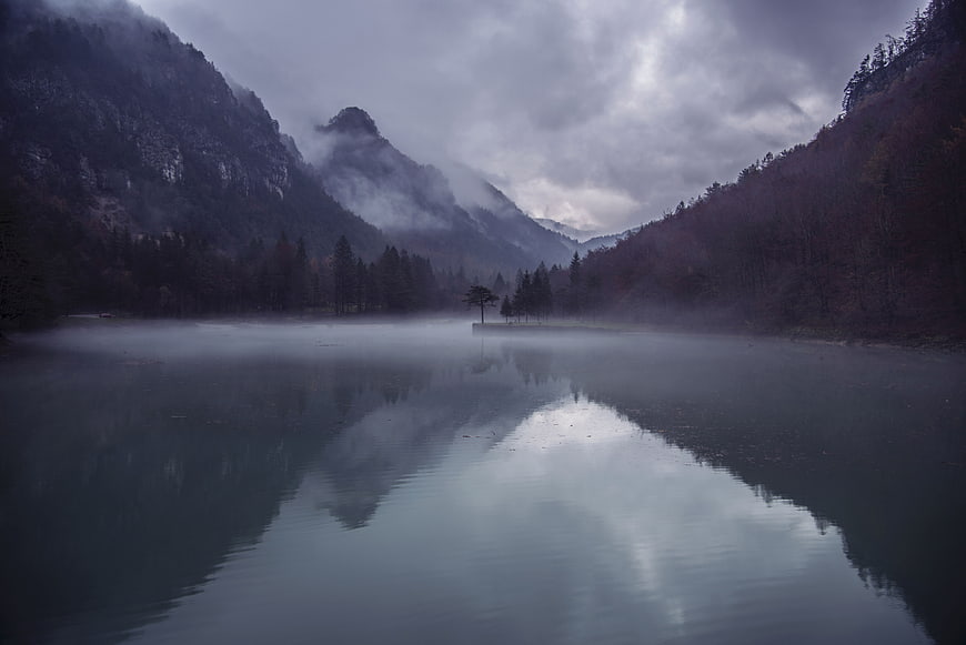 Misty Mountain Lake Reflection in Dark Forest Landscape