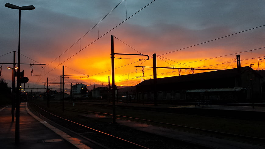 Silhouette of Train Tracks at Vibrant Sunset