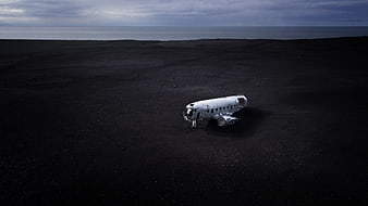 Crashed airplane on black sand beach in Iceland