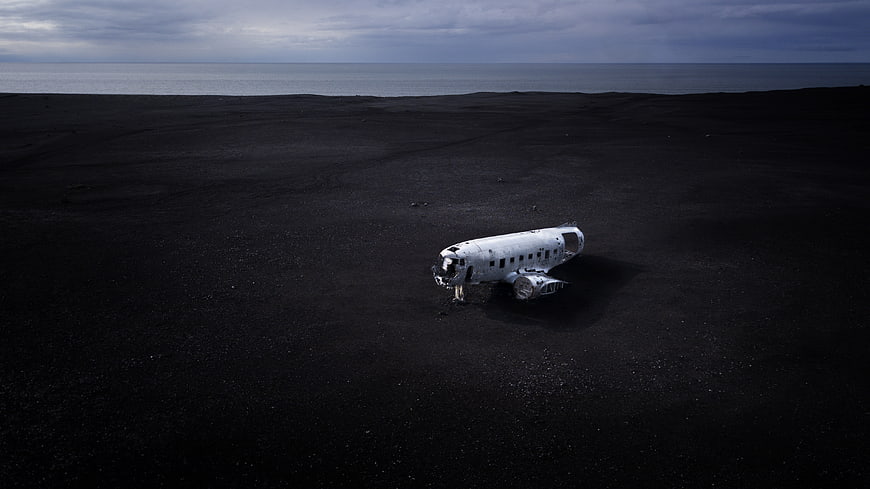 Crashed airplane on black sand beach in Iceland